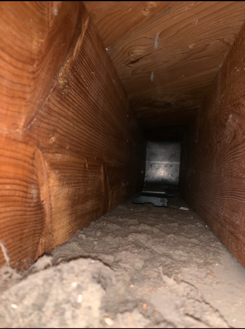 Residential duct before cleaning, heavy buildup