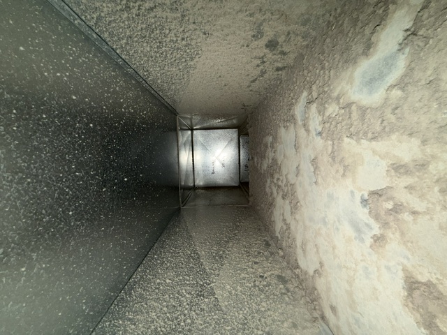 Residential attic duct before cleaning